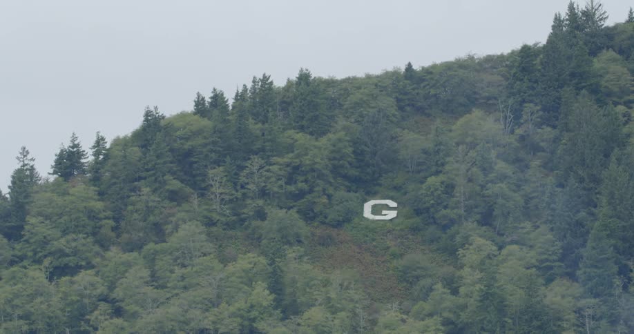 The letter g on a hilltop