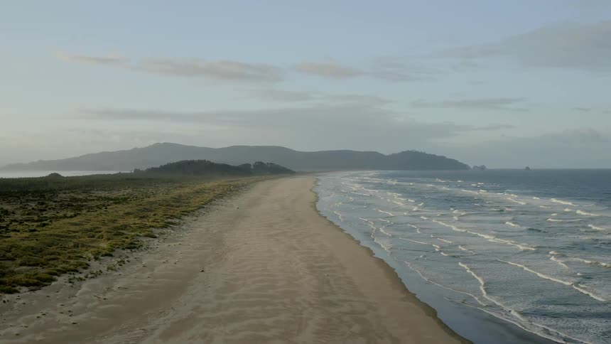 An aerial view of a beach coastal at cloudy day
