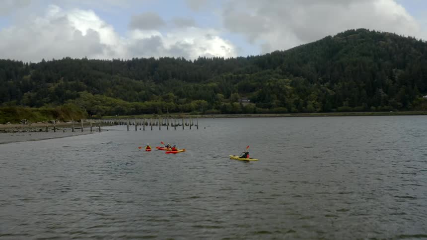An aerial shot of kayaks on a lake