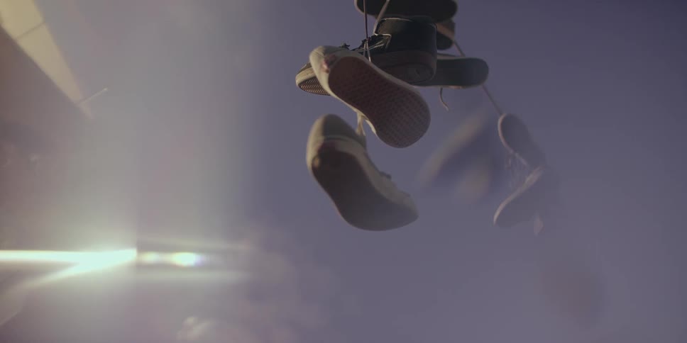 Shoes hang from a power line