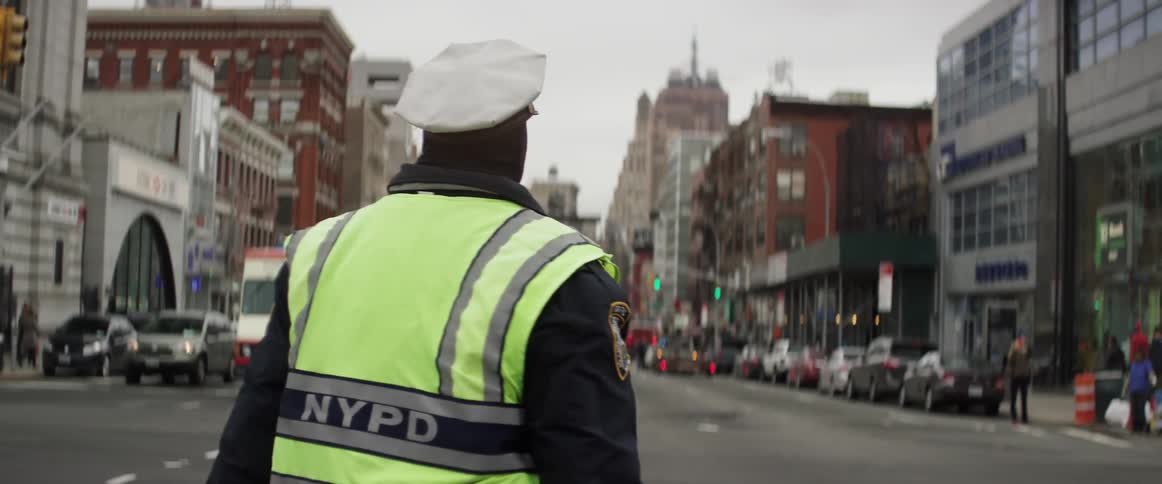 An nypd traffic cop directing traffic