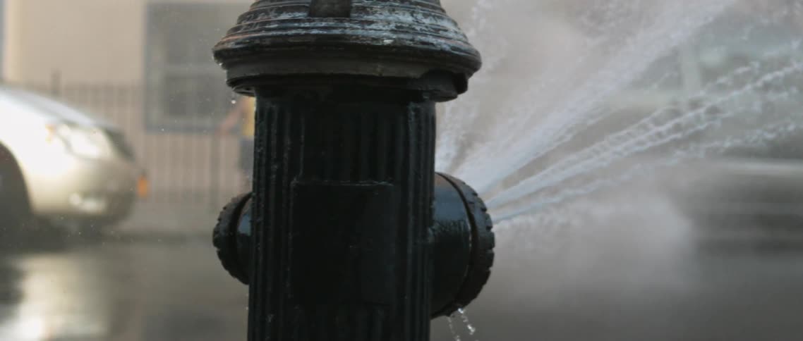 Fire hydrant spraying in the city