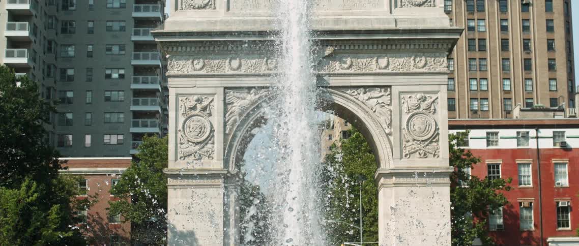Fountain spraying up in the middle of a city park