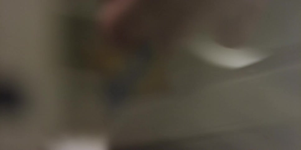 A credit card being swiped shown in very blurry close up