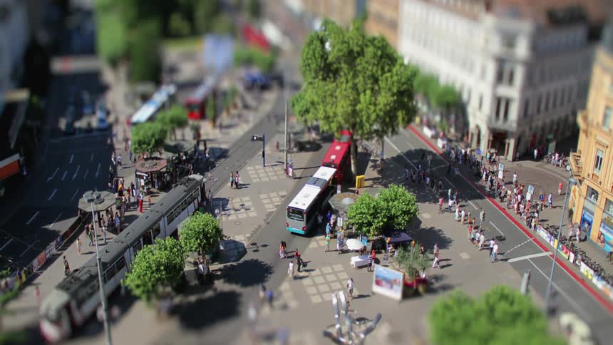 Pedestrians and vehicles bustling in a city