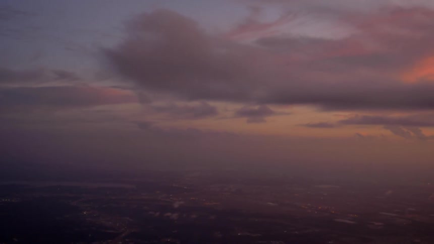 Clouds blowing through the sky during sunset