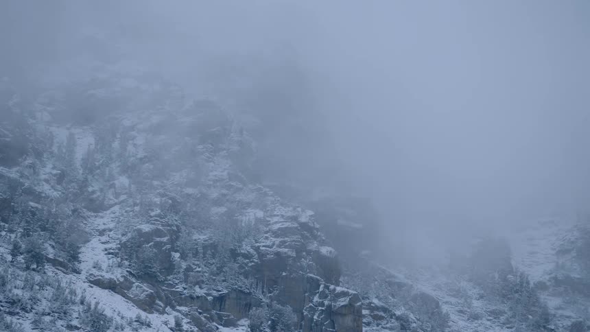 A scenery of a foggy mountain