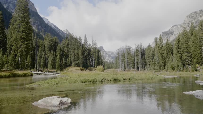 The water leads to the mountain range ahead