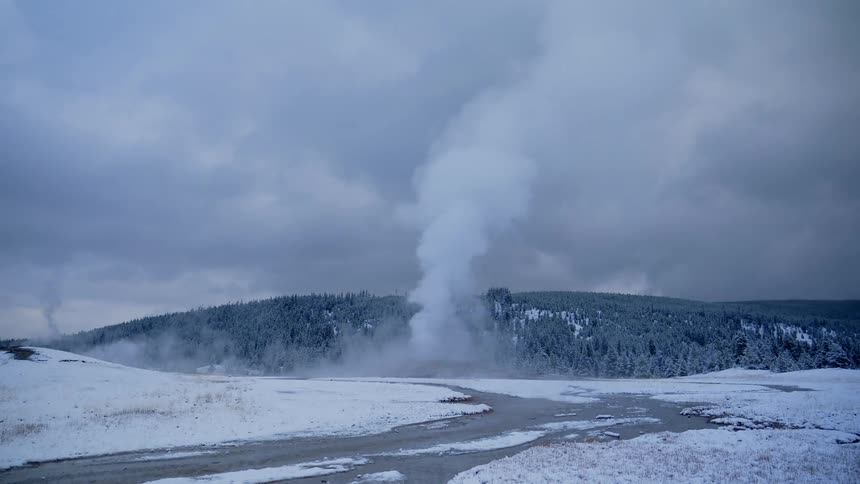 A steam geyser blows up out of the ground