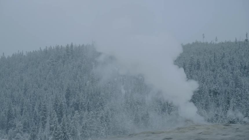Steam belches out of a hole in the ground