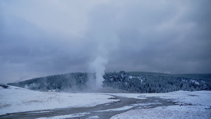 A geyser blows off a stream of steam