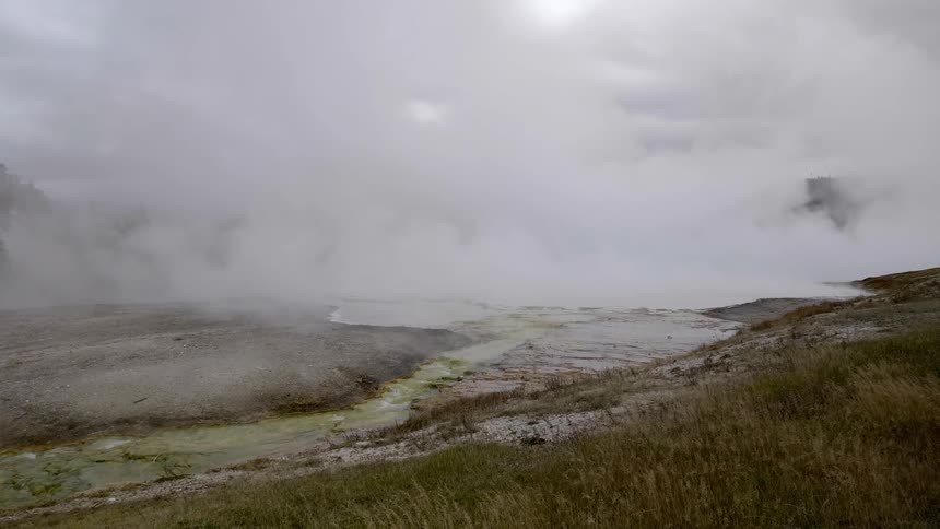 Steam coming from the ground near hot springs