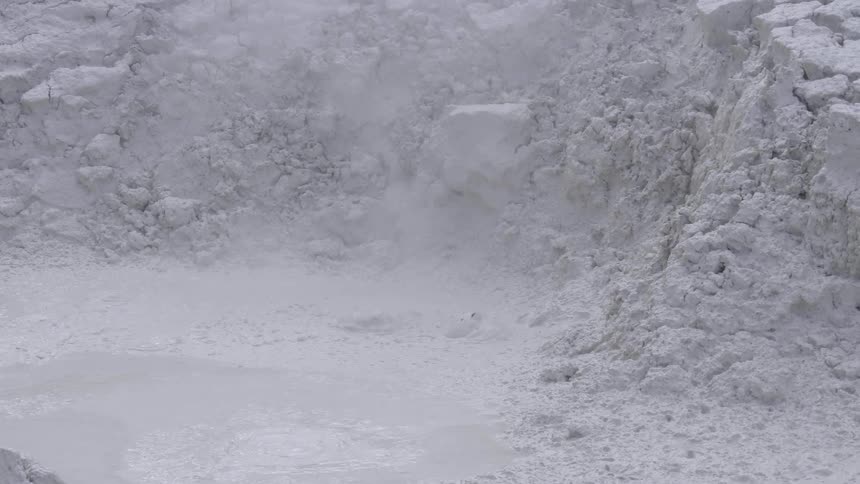 Bubbles erupt in a crater