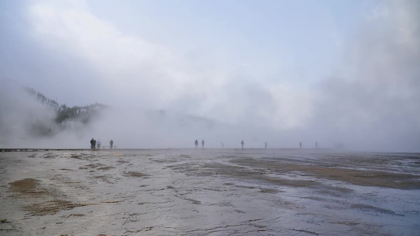 Tourists visiting hot springs and geysers at park