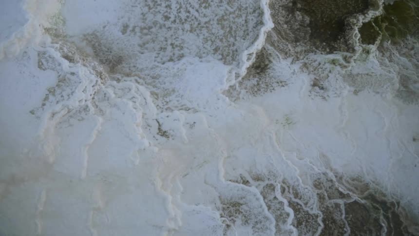 Birds eye view of snow falling over the landscape