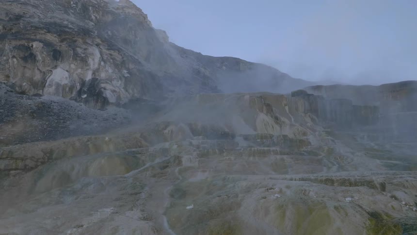 A thin mist over rocky uneven terrain