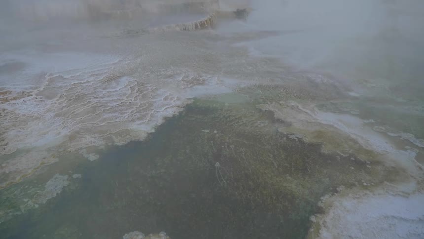 An aerial view of a mountain frowm the cloud