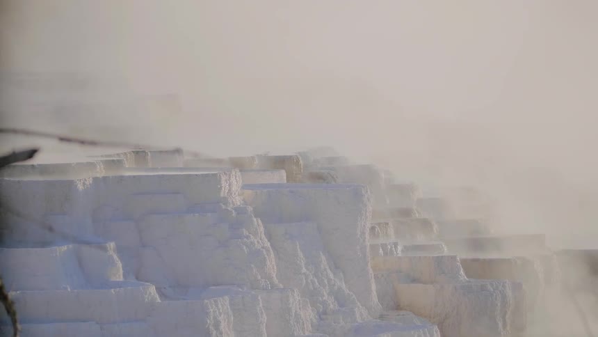 Fog passes over big slabs of snow