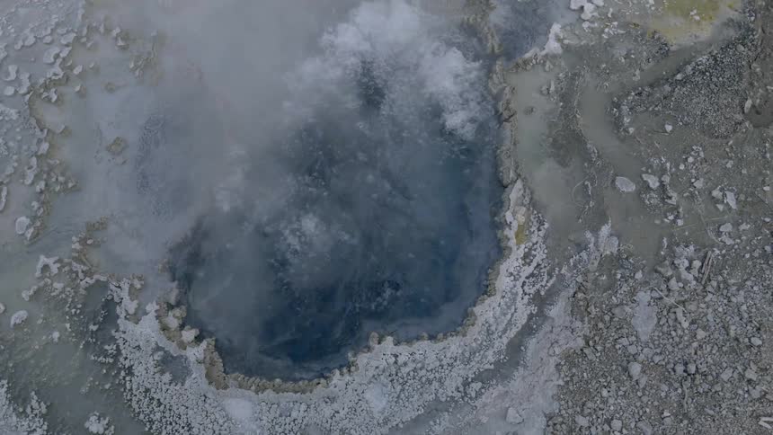 Birds eye view of water bubbling in a geyser