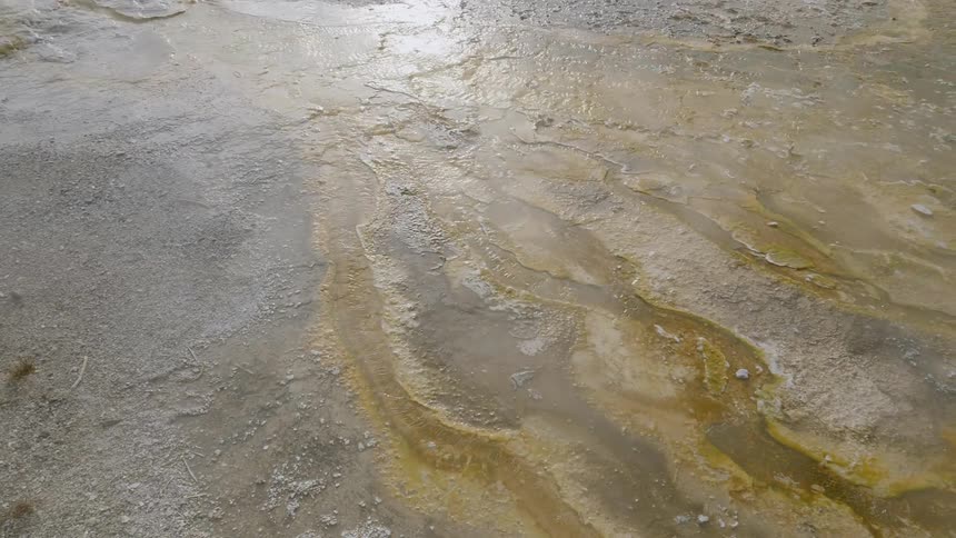 Molten trails flow through hot mud