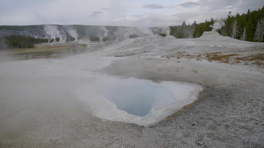 Steam rising off of the flat ground