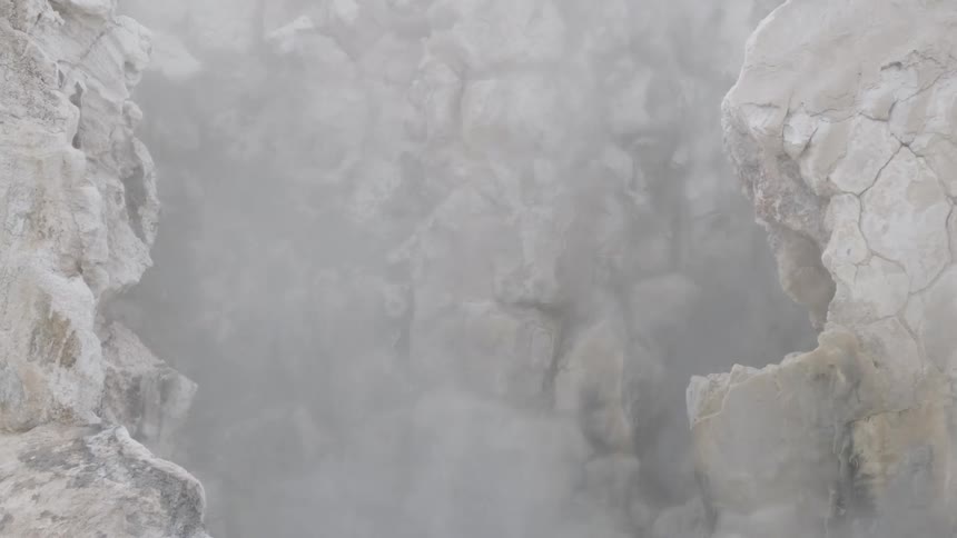 Steam rises up from the ground
