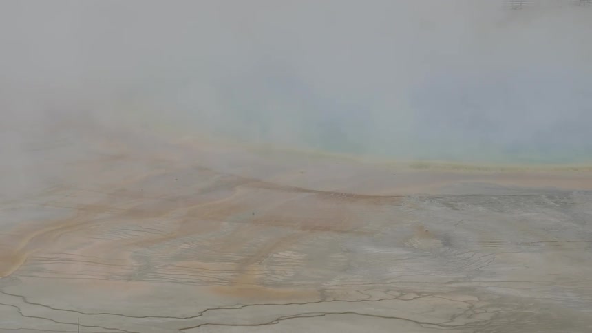 Birds eye view of mist over flat dry land
