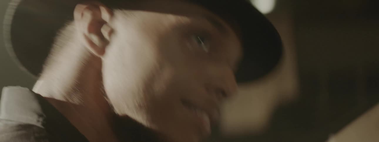 Close up view of a male drummer performing on drums