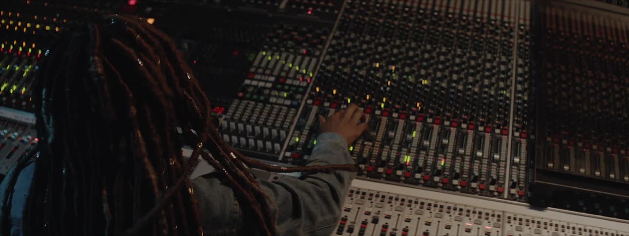 Sound engineer mixing music in studio