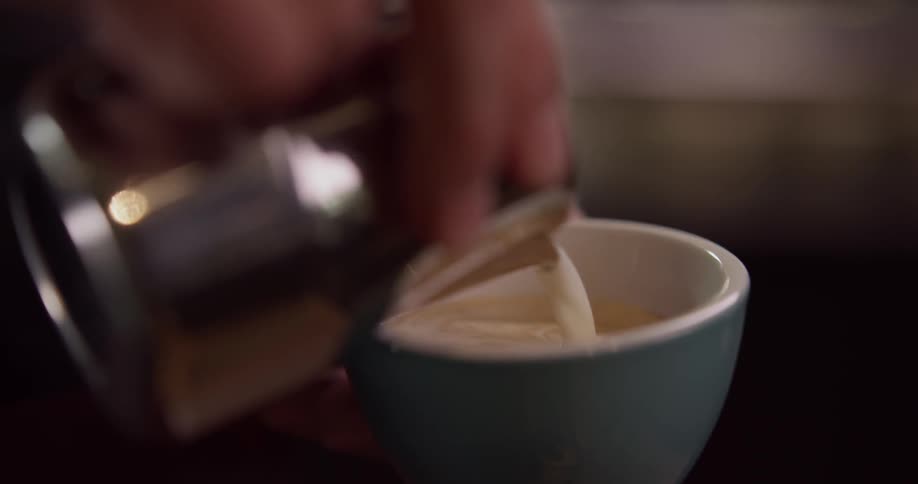 A barista making a cup of coffee