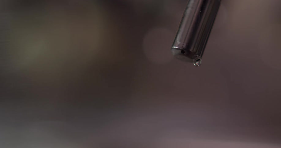 Steam comes out of a faucet and then water droplets fall