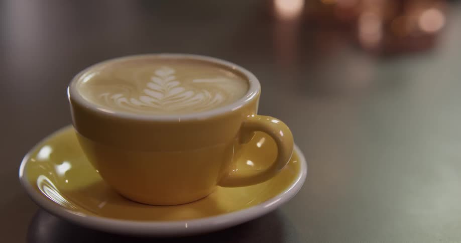 Cup of coffee with steamed milk latte art
