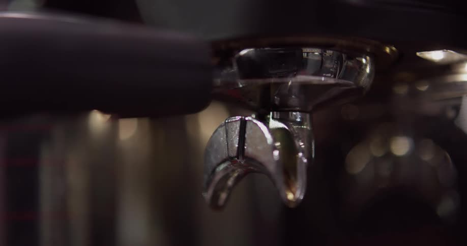 A person attaches a lever to a machine