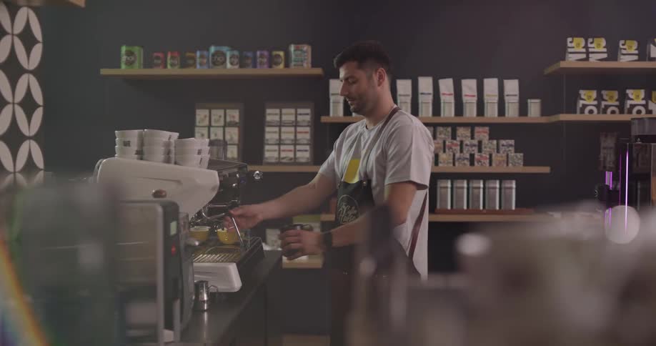 A man makes coffee