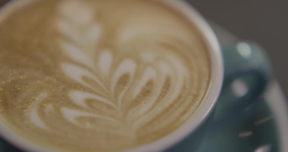 Close up of latte art on cup of coffee