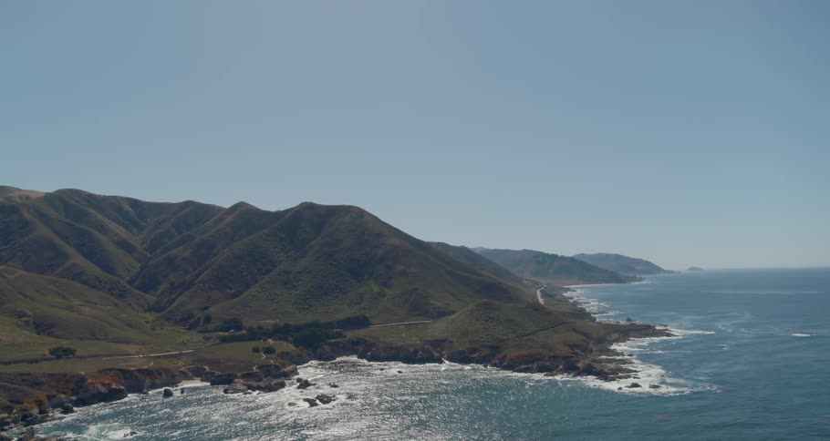 A mountainous ocean coastline during the day