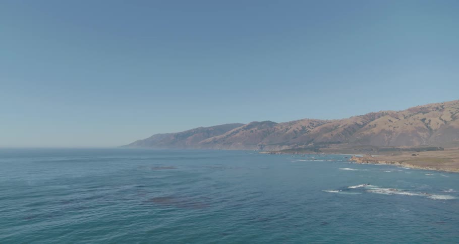 Aerial view of coast and mountain range