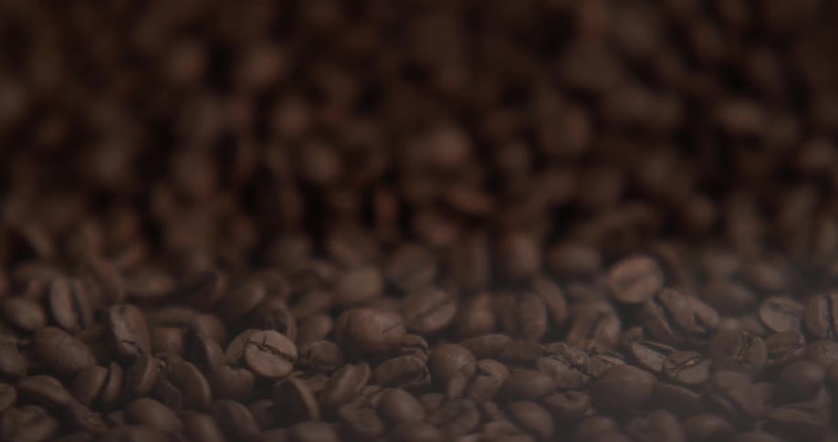 Close up of coffee beans being mixed