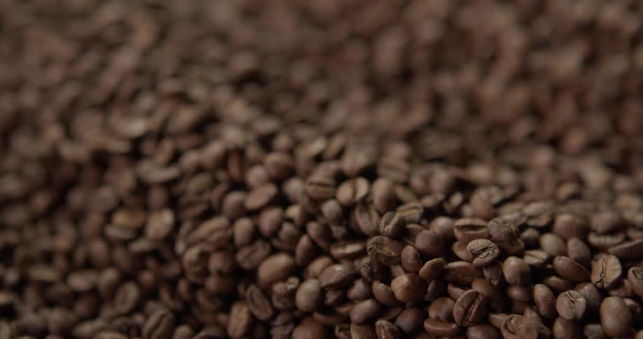 Close up of coffee beans being mixed