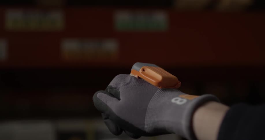 A person with a glove on puts their arm out and shoots a light off of the glove
