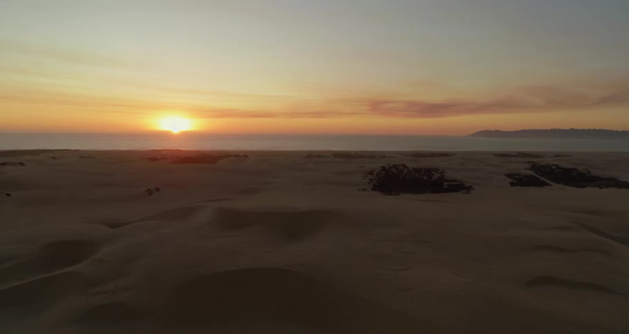 The sun hovers over the horizon