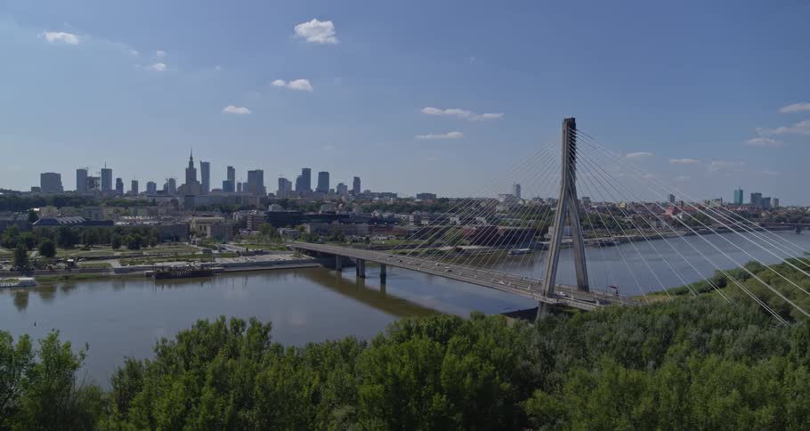 Suspension bridge over river on waterfront city