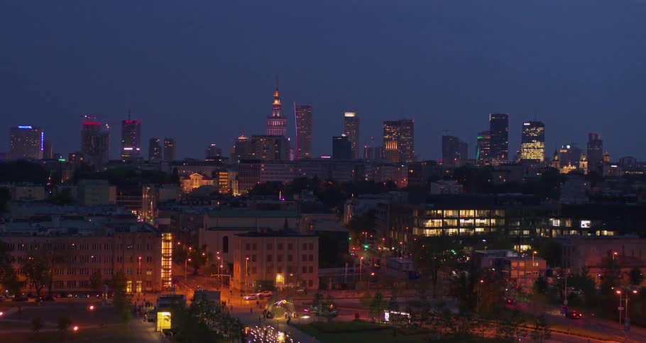 The well lit buildings of a metropolis at night