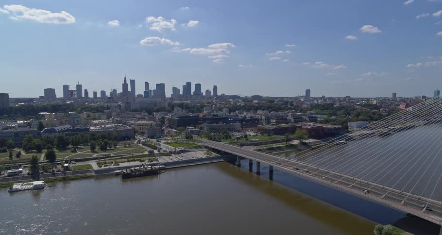 Landscape view of a city with a bridge crossing the water