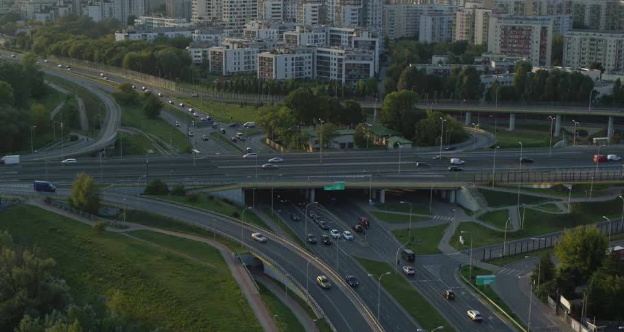 Cars travel on city highways and overpasses