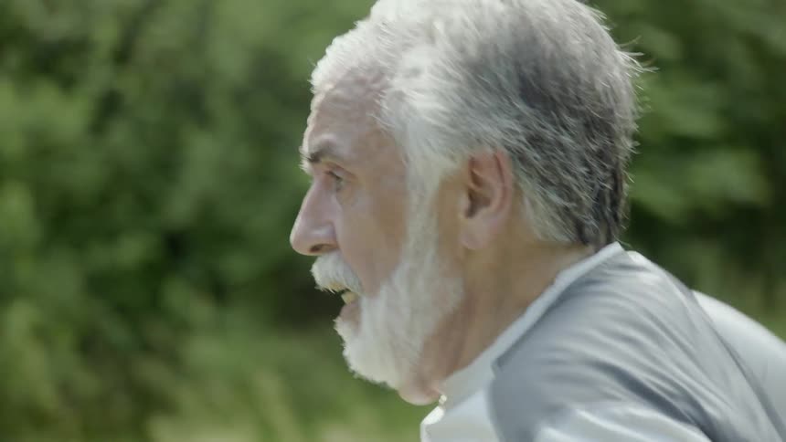 A man is running on a sunny day