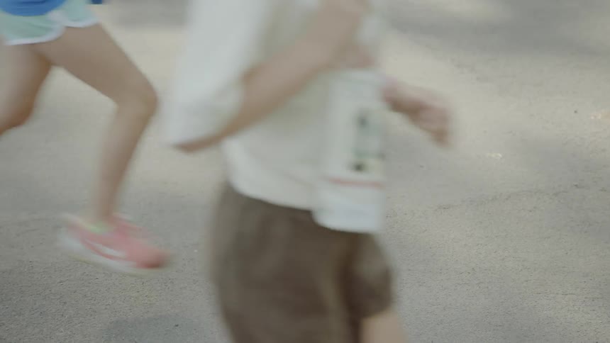 People run a marathon on the asphalt road during daylight
