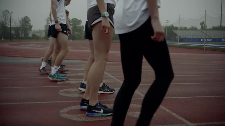 The athletes line up and run off on the track