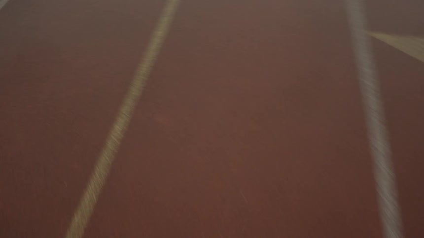 A person running on a running track
