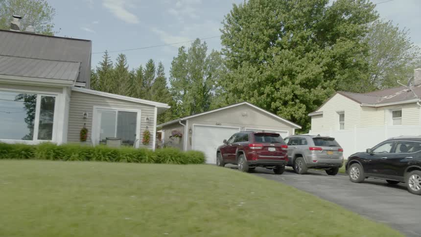 The yards are empty in front of the homes